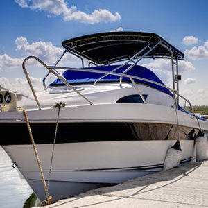 A Bayliner 2455 Ciera boat docked, indicating availability for wet slip rentals.
