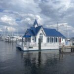 Scenic view of houseboat rentals in the Florida Keys, offering unique stays on clear waters with stunning tropical surroundings.
